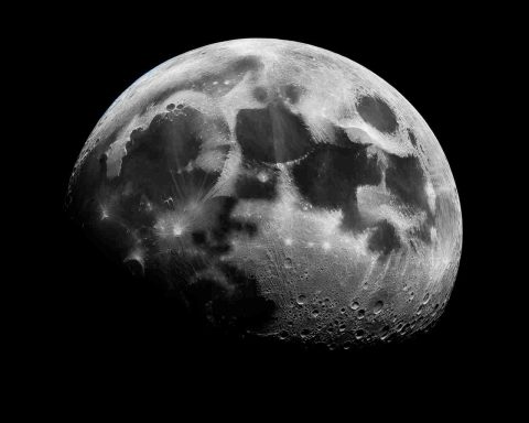 High-definition, realistic photograph of the Moon's surface, showcasing its raw and unaltered beauty, captured in a light that emphasizes it as an emblem of heritage conservation and untouched frontier.